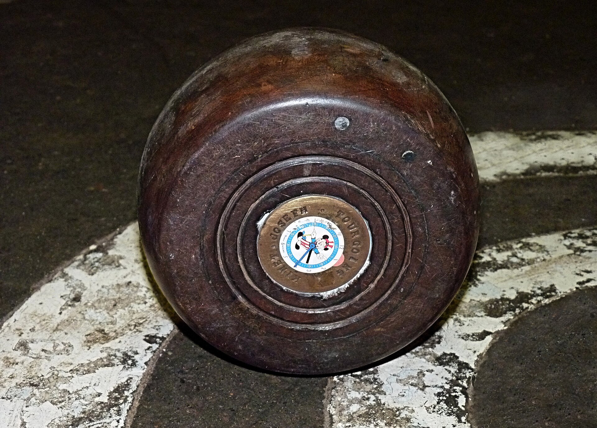 A turned wooden bowl, side profile