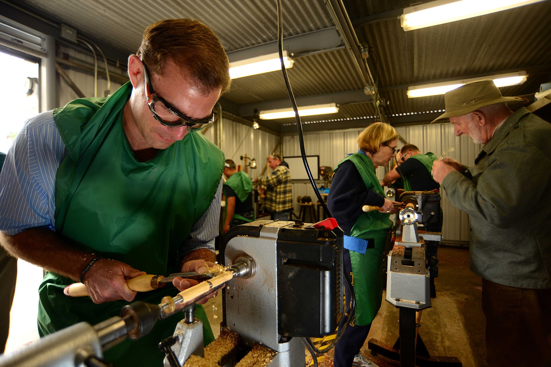 A woodturning workshop session at the lathe